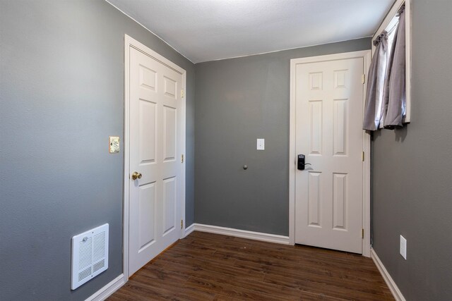 doorway to outside with dark hardwood / wood-style floors