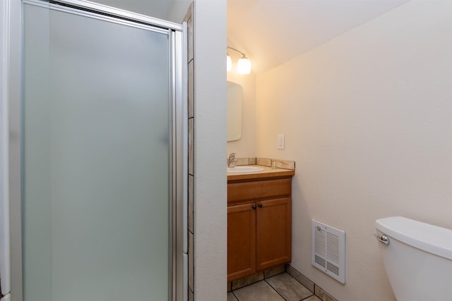 bathroom with vanity, an enclosed shower, toilet, and tile patterned flooring