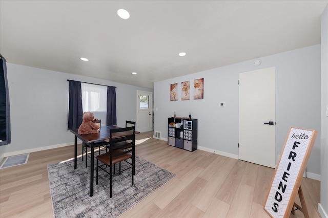 dining area with light hardwood / wood-style flooring