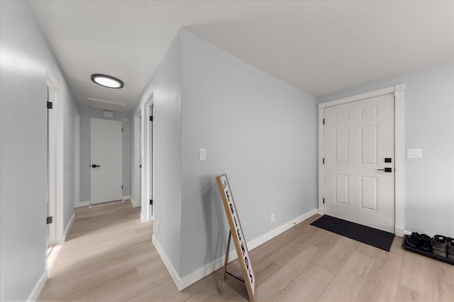 foyer entrance with light hardwood / wood-style flooring