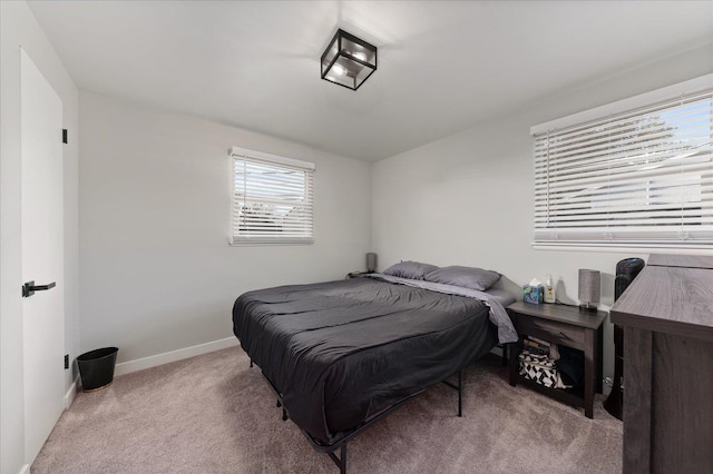 bedroom with light colored carpet