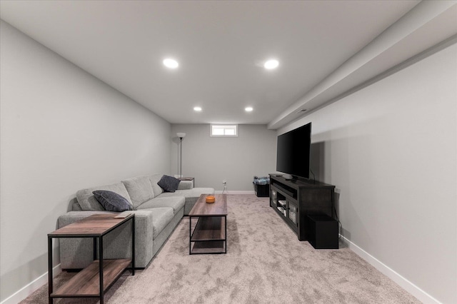 carpeted living area featuring recessed lighting and baseboards