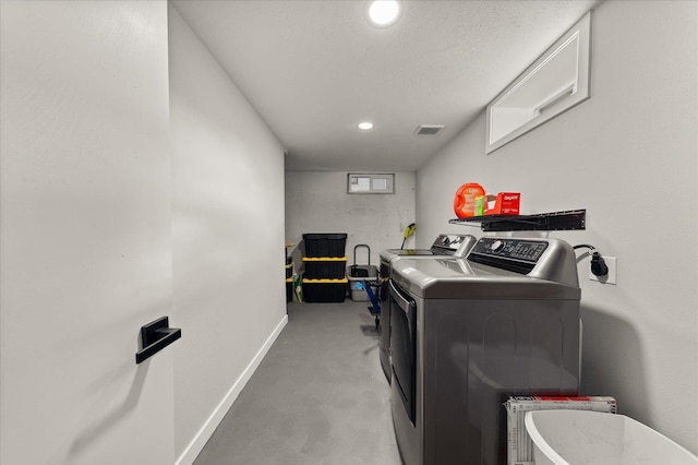 laundry area featuring visible vents, washing machine and dryer, recessed lighting, baseboards, and laundry area