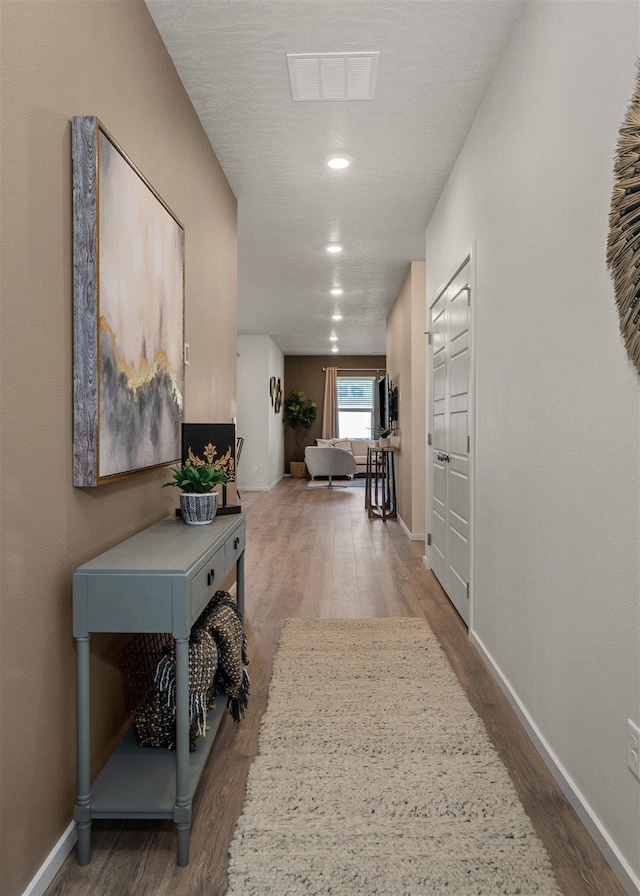 hall with dark hardwood / wood-style floors