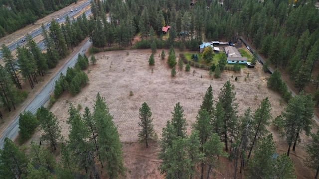 birds eye view of property with a rural view