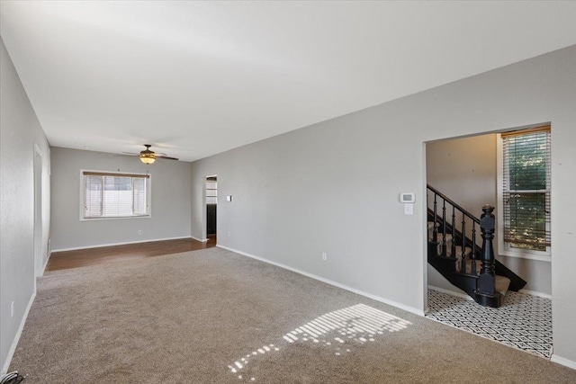 carpeted empty room with ceiling fan