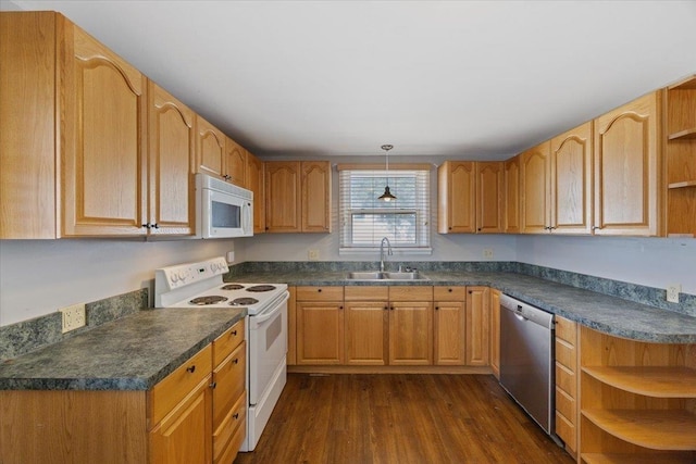 kitchen with white appliances, dark wood-type flooring, sink, and hanging light fixtures