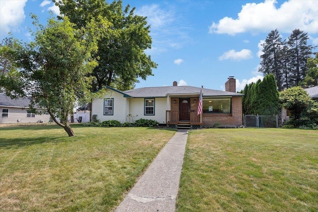 ranch-style home featuring a front yard