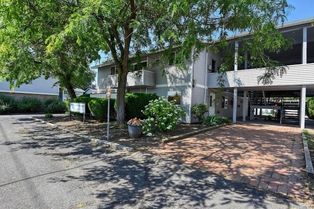 view of front facade with a carport