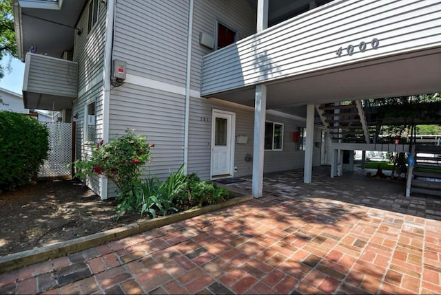 exterior space featuring a balcony and a patio area