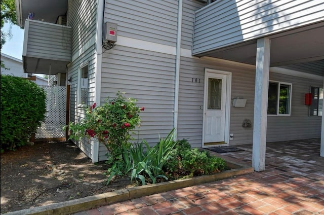 doorway to property featuring a patio area and a balcony