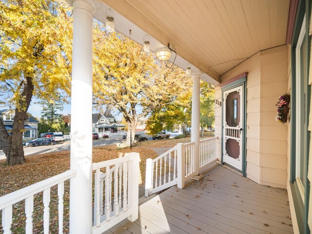 victorian home featuring a porch and a front lawn