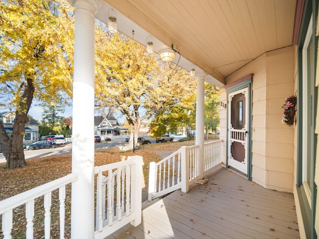 deck featuring a residential view and a porch