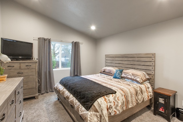 carpeted bedroom with vaulted ceiling