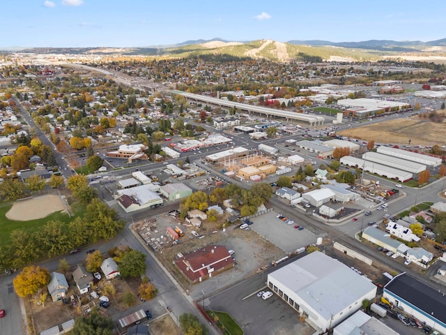 birds eye view of property with a mountain view