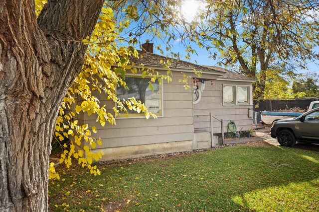 view of home's exterior featuring a lawn