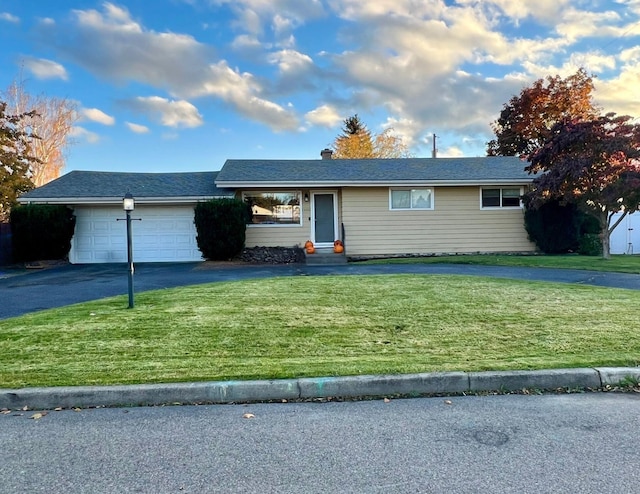 13222 E Nixon Ave, Spokane Valley, WA 99216 - ranch-style home featuring a front yard and a garage