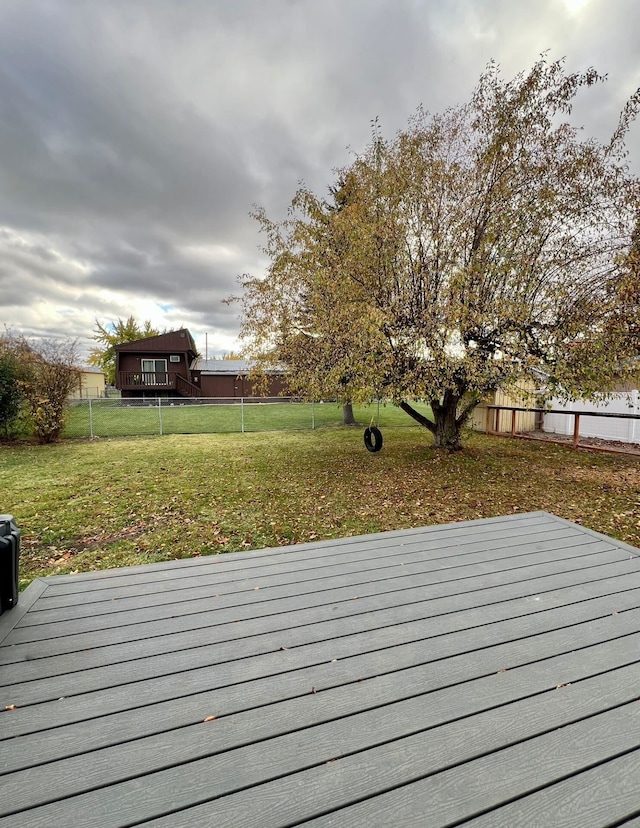 wooden terrace with a yard