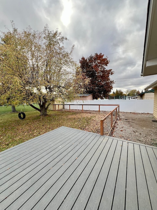 wooden terrace with a yard