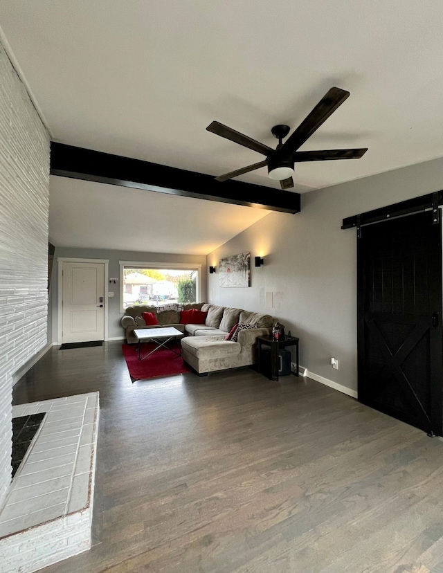 unfurnished living room with vaulted ceiling with beams, hardwood / wood-style flooring, and ceiling fan