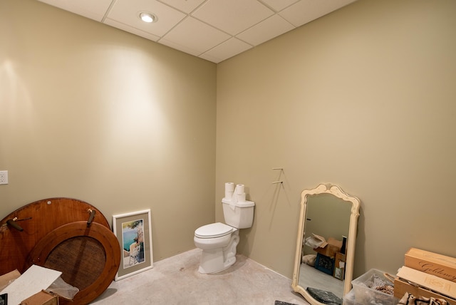 bathroom with toilet and a paneled ceiling