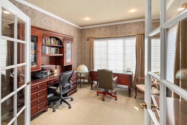 carpeted home office featuring ornamental molding and a textured ceiling