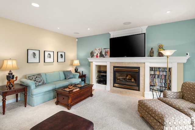 living room with carpet flooring and a fireplace