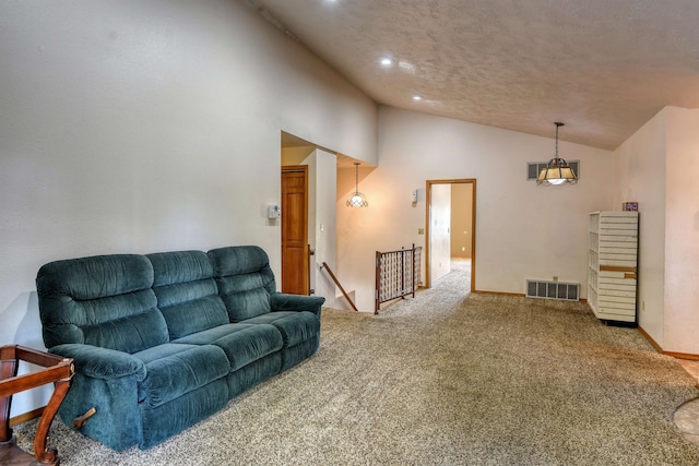 living room with a textured ceiling, carpet flooring, and high vaulted ceiling