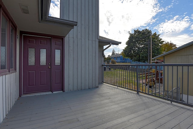 entrance to property featuring a deck