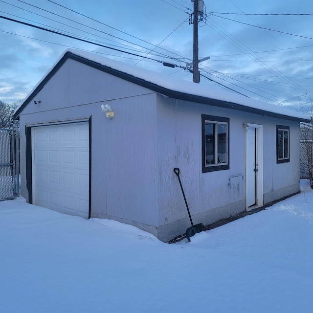 view of snow covered garage