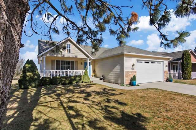 view of front of home with a porch, a front yard, and a garage