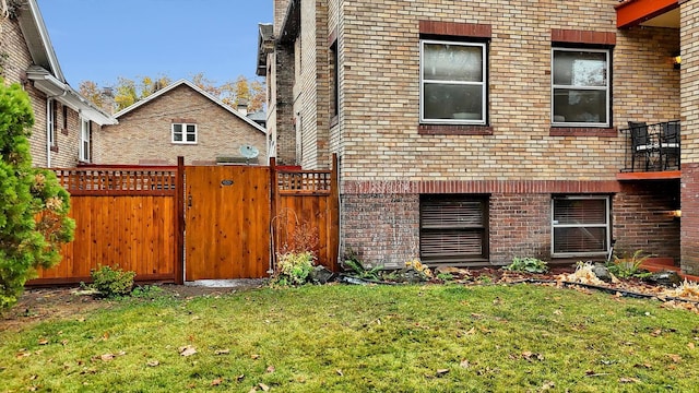 view of side of property with a lawn