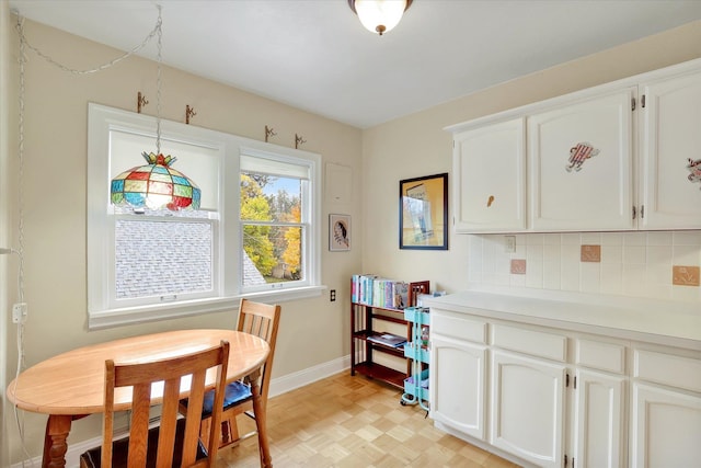 dining space featuring light parquet floors