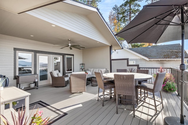 deck featuring an outdoor hangout area and ceiling fan