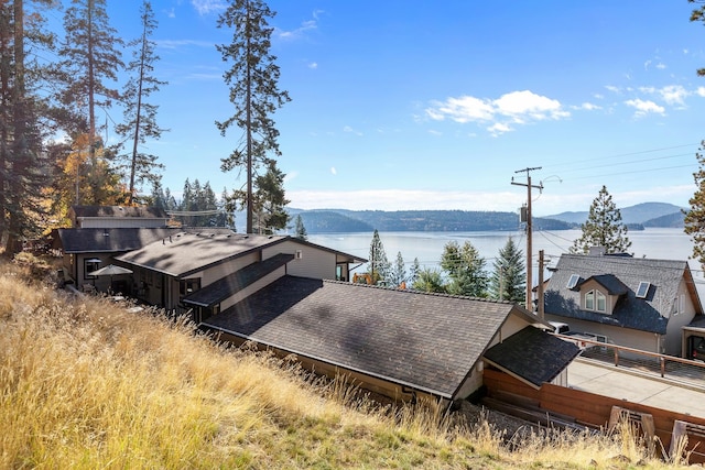 exterior space featuring a water and mountain view