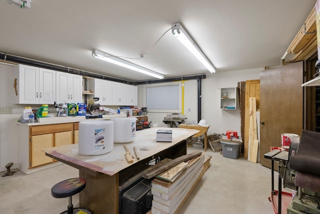 kitchen featuring a kitchen island and white cabinets