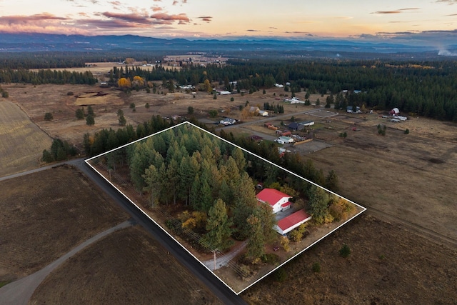 aerial view at dusk with a mountain view