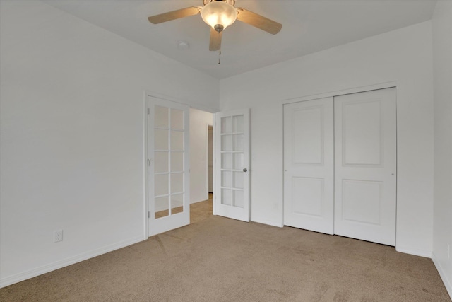 1005 S Oswald St, Spokane, WA 99224 - unfurnished bedroom featuring french doors, carpet, a closet, baseboards, and ceiling fan