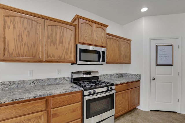 1005 S Oswald St, Spokane, WA 99224 - kitchen featuring stainless steel appliances and brown cabinetry