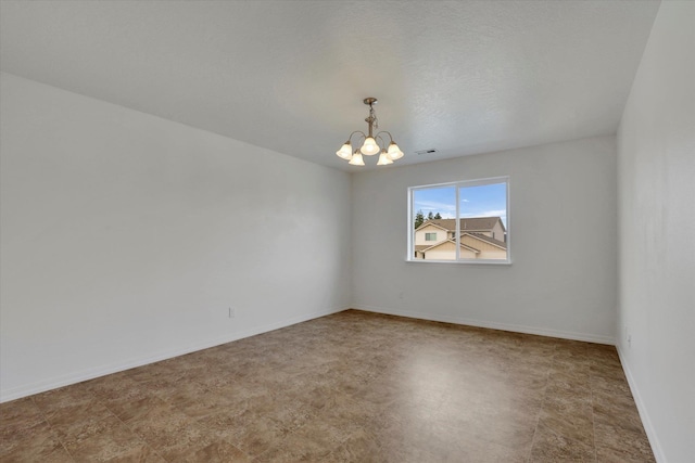 1005 S Oswald St, Spokane, WA 99224 - unfurnished room featuring a chandelier and baseboards