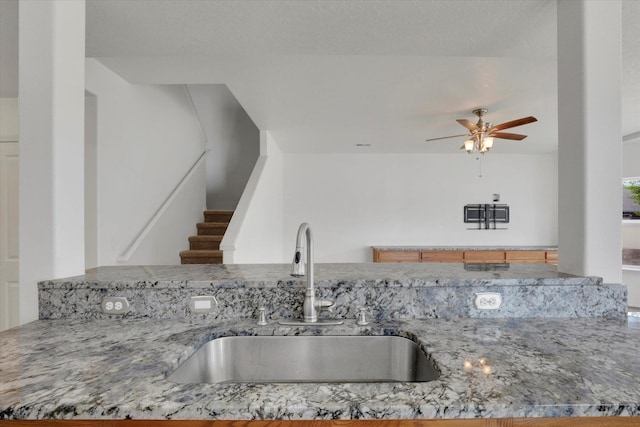 1005 S Oswald St, Spokane, WA 99224 - kitchen with a sink, ceiling fan, and stone counters