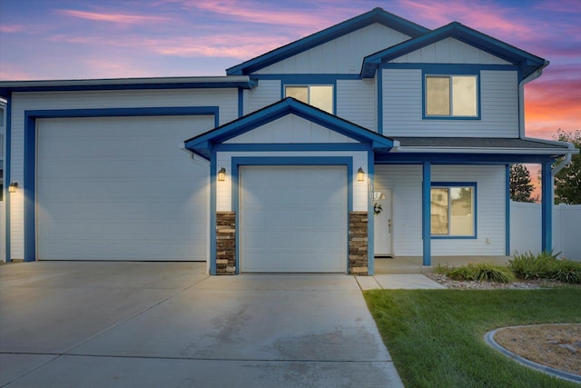 1005 S Oswald St, Spokane, WA 99224 - view of front of property with driveway, a garage, covered porch, and board and batten siding