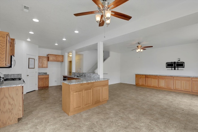 1005 S Oswald St, Spokane, WA 99224 - kitchen with a ceiling fan, stainless steel microwave, recessed lighting, light stone counters, and open floor plan