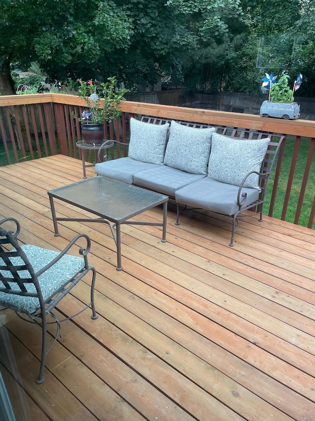 wooden terrace featuring an outdoor hangout area