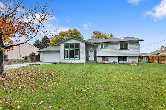 view of front of home with a garage and a front yard