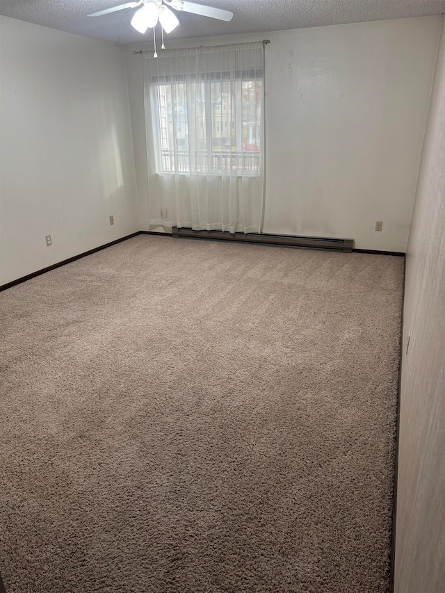 empty room with a textured ceiling, carpet, and ceiling fan