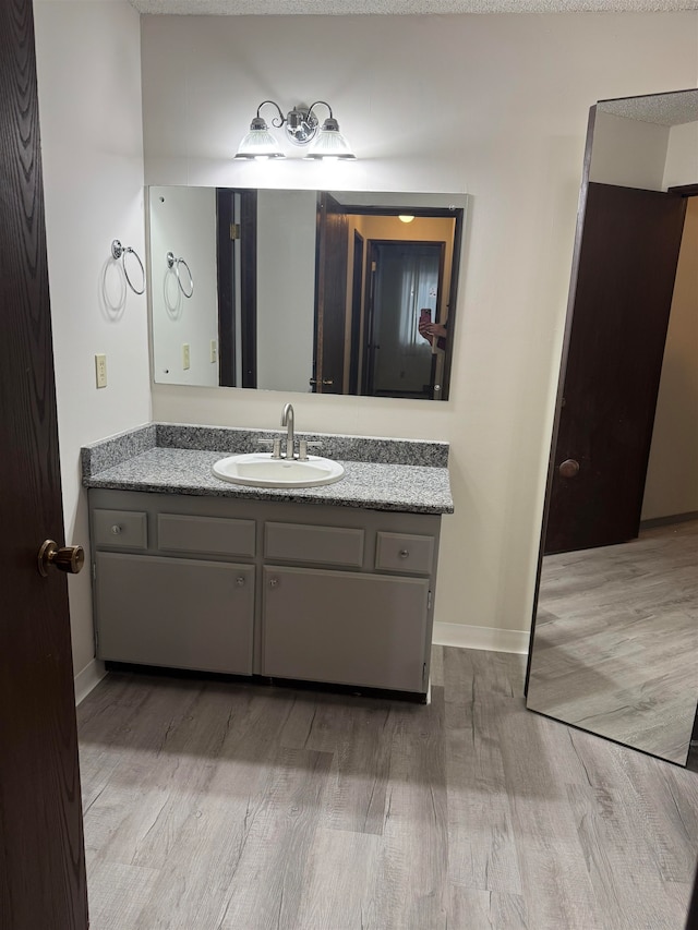 bathroom featuring vanity and hardwood / wood-style flooring