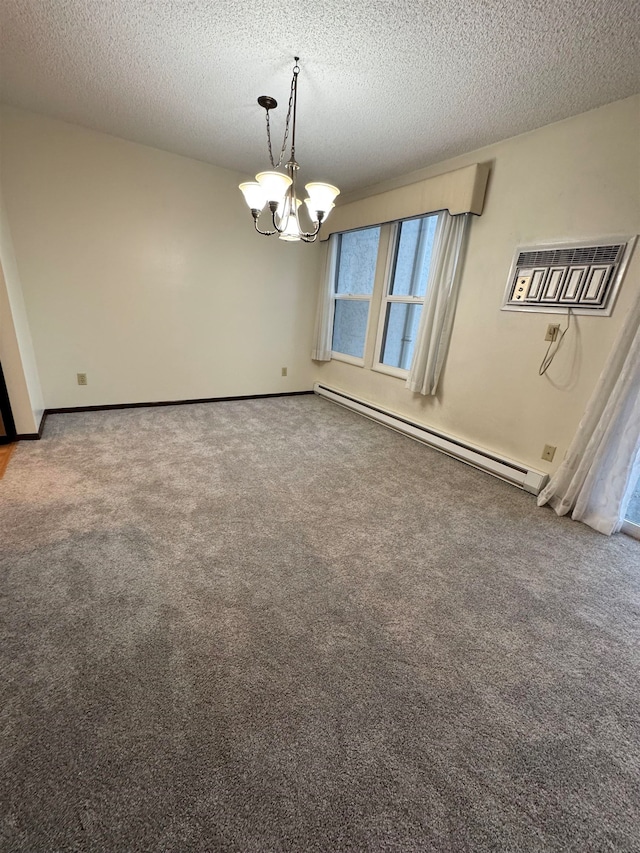 unfurnished dining area with an inviting chandelier, a wall unit AC, a textured ceiling, and baseboard heating