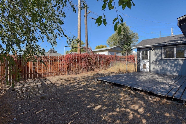 view of yard with a wooden deck