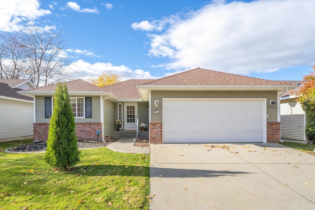 view of front of property featuring a garage and a front yard